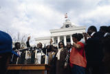 Hosea Williams speaking in front of the Capitol in Montgomery, Alabama, at the conclusion of the 20th anniversary reenactment of the Selma to Montgomery March.