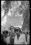 [Young women with signs raised behind them at the March on Washington, 1963]