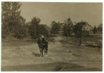 Photos taken during noon hour, October 23rd, 1912, at the Loray Mills, Gastonia, N.C. They said they were working and went in to work. At night I counted over thirty children coming out when the whistle blew, and they seemed to be from ten to twelve years old. The Superintendent was much disturbed over the photos.  Location: Gastonia, North Carolina.