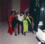 Berry Gordy and others posing for a group portrait at a New Year's Eve party, Los Angeles, 1971