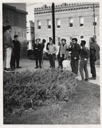 Mississippi State Sovereignty Commission photograph of Rims Barber, Ralph Heller and Bob Boyd standing with a group of men and women outside of the Greenville Post Office, Greenville, Mississippi, 1960s