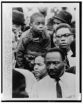 [Martin Luther King, Jr. pictured in crowd at the end of the Selma-Montgomery Rights March, Montgomery, Alabama]