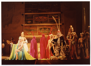 Performance picture of Eartha Kitt (sitting, green turban, on the left) and many cast members]. [color photoprint