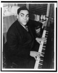 [Fats Waller, three-quarter length portrait, seated at piano, facing front]