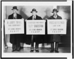 [Left to right, holding signs of the St. Louis branch of the NAACP: Leonard Harris holding sign "a jury trial for everybody"; Nathaniel A. Sweet holding sign "remember Pearl Harbor, but don't forget Sikeston"; Harry R. Bracy holding sign "pass anti-lynch law now"]