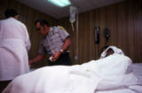 Patient receiving medical treatment at a prison hospital