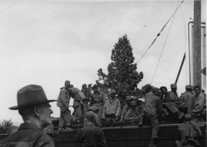 African American servicemen assisting