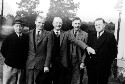 Unidentified group of men. Jackson Davis wearing a hat