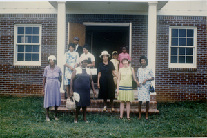 Thumbnail for Marjorie Merrill (2d from right) and church members at rebuilt Antioch Church, Blue Mountain, Miss.