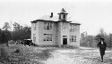 Unidentified building.African American male running towards the camera