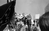 Man speaking to white demonstrators in front of the Capitol in Montgomery, Alabama, during a rally protesting the Selma to Montgomery march.