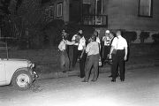 Roosevelt Barnett speaking to police officers during a civil rights demonstration in Montgomery, Alabama, after they had blocked a march to the Capitol.