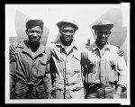 [Three members of the ground crew with the 99th Fighter Squadron]