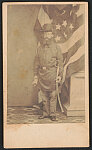 [Unidentified soldier of 1st or 2nd Rhode Island Infantry Regiment in uniform with sword and American flag in background]