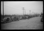 [Untitled photo, possibly related to: Day laborers being hired for cotton picking on Mississippi and Arkansas plantations. Between four and six-thirty every morning during the season, near the Hallan Bridge in Memphis, Tennessee, crowds of Negroes in the streets gather and are loaded into trucks by drivers who bid, and offer them anywhere from fifty cents to one dollar per day]