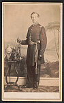 [Unidentified musician in Union uniform with trumpet in front of painted backdrop showing landscape]