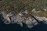 An October 2017 aerial view of homes high above the Atlantic Ocean on the rocky coast of Maine, near Bald Head Village