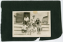 Kids seated on the back stoop of the Phyllis Wheatley Settlement House, Minneapolis