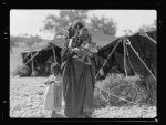 Negroid mother and children. Before their tent home among the foot hills near Beit Jibrin