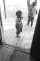 Young son and daughter of John Nixon, on the front porch of their home in Autaugaville, Alabama.