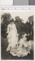 Two young women pose in costumes of early 19th century St. Louis in the Pageant of St. Louis