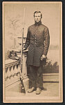 [Unidentified soldier in Union uniform with bayoneted rifle, and Hardee hat, in front of painted backdrop showing trees and body of water]