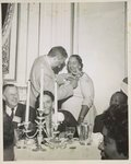 Thurgood Marshall pins orchid on Mrs. Lulu White, director of branches for the Texas State Conference of NAACP branches, at Freedom Fund Dinner, Sheraton-Palace Hotel, on June 28, during 47th annual NAACP Convention in San Francisco, June 26-July 1956 Seated left are Kivie Kaplan, of Boston, co-chairman, NAACP life membership committee, and Mrs. R.P. Beshears of St. Joseph, acting president of the Missouri State Conference of NAACP branches /