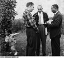 Cleo Blackburn Talking with Two Men