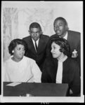 [Linda Brown Smith, Ethel Louise Belton Brown, Harry Briggs, Jr., and Spottswood Bolling, Jr. during press conference at Hotel Americana]