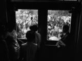 Dorothy Frazier addressing a crowd from the stoop of a brick building at Alabama State College in Montgomery, Alabama, during a student demonstration.