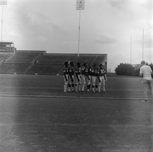 Football players standing in a line