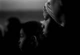 Young woman waiting to receive a bag of food from the Alabama Action Committee at Bell Street Baptist Church in Montgomery, Alabama.