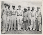 Thumbnail for Tuskegee officers posing with their base commander Noel F. Parrish (4th from left) and unidentified man