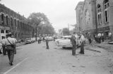 Thumbnail for Damaged cars and debris beside 16th Street Baptist Church in Birmingham, Alabama, after the building was bombed.