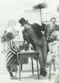 Chimney sweep talks to girl during the Celebration of Neighborhoods