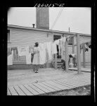 Arlington, Virginia. FSA (Farm Security Administration) trailer camp project for Negroes. Hanging out washing in front of the community building