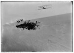 [Three-quarter right front view of Wright glider descending from Big Hill. One of four photographs of gliding activities taken on October 27, 1903, when Wilbur and Orville each made two glides]