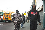 Three black men, view along Nostrand Ave. from Fulton St., Brooklyn, 2017