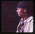 Watch cap man profile in the courtyard, Pike Place Market, circa 1967