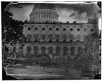 [Washington, D.C. Spectators at side of the Capitol, which is hung with crepe and has flag at half-mast]