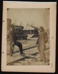 [Military railroad operations in northern Virginia: soldier and another man standing at railroad tracks in front of locomotive]