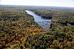 An October 2017 aerial view of Maine forestland and Chase's Pond, which here and in many other spots looks more like a river than a lake, near York