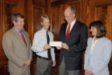 Sister Cities board members Doug Berry and Burkley Allen present a flood relief check, from donations gathered at a concert in Nashville’s sister city Magdeburg, Germany, to Mayor Karl Dean and Executive Director of Hands on Nashville Brian Williams