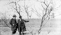 Mr. Evans and Dr. Sage studying the prunning of a Peach tree at Fort Valley H and I school