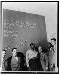 [African American veteran Isaac Woodard standing in the Wendell Willkie memorial building in New York with some of his supporters (l to r) Dan James, an unidentified representative from the American Legion, Mr. Woodard, Joe Walker, Walter White, and Barney Ona]