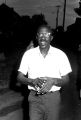 Dan Houser marching down a street in a neighborhood in Montgomery, Alabama, during a civil rights demonstration.