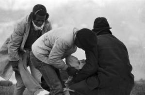 Several people assisting Amelia Boynton after she and other civil rights marchers were beaten and gassed by state troopers on Bloody Sunday in Selma, Alabama.