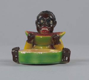 Ashtray in the form of a “picaninny” boy eating a watermelon slice