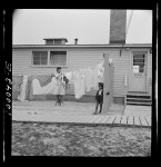 Arlington, Virginia. FSA (Farm Security Administration) trailer camp project for Negroes. Hanging out wash in front of the community building