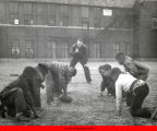 Group of boys playing football with a referee